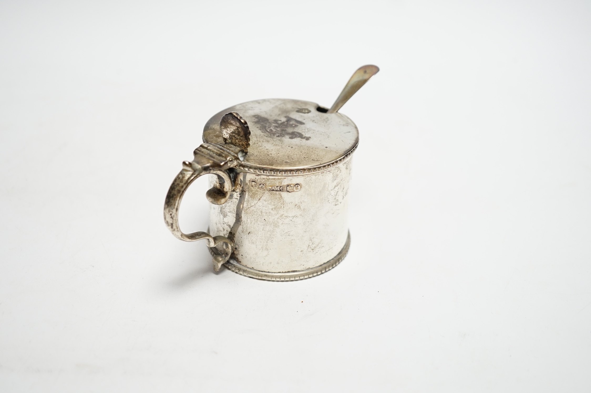 A Victorian Scottish silver drum mustard, James McKay, Edinburgh, 1861, height 72mm, with an earlier associated silver spoon